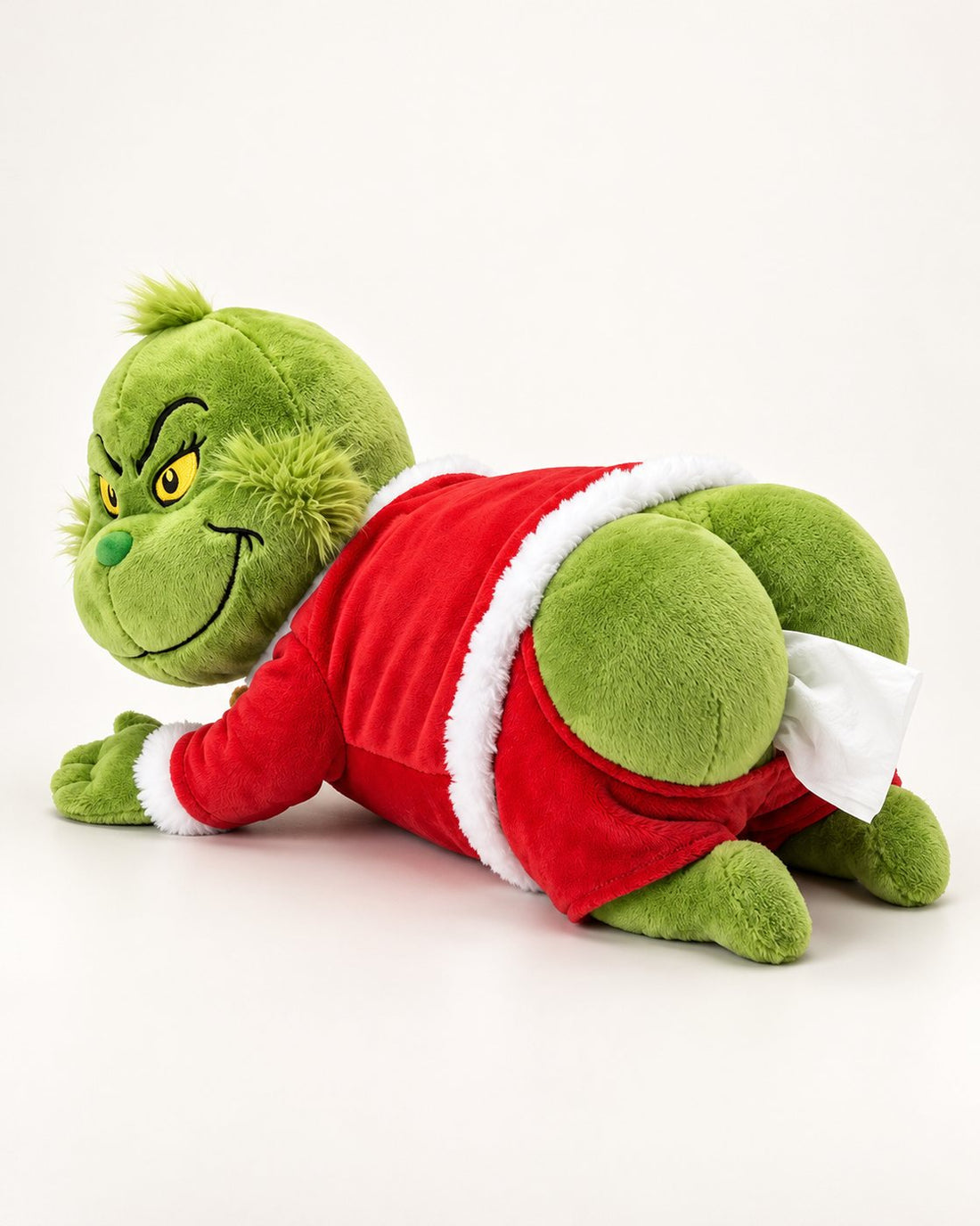 The Grumpy Rump plush tissue holder: a green plush in a red suit with a tissue sticking out of its rear